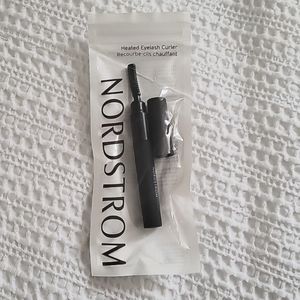 Heated eyelash curler